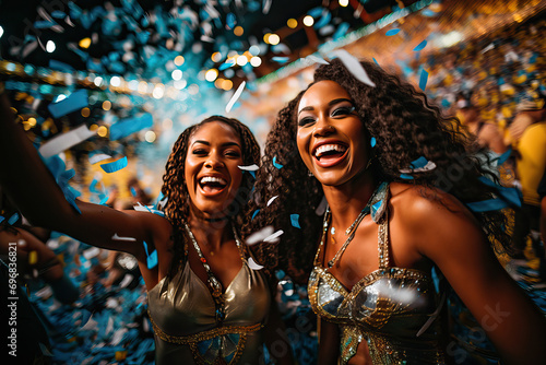 Young women dancing and enjoying the Carnival in Brazil photo