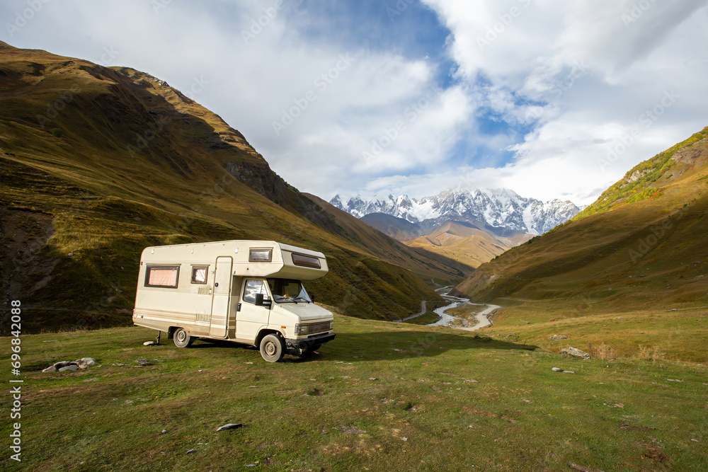 Motor home in the mountains at sunset