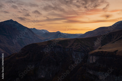 Caucasus mountains after sunset, dramatic landscape