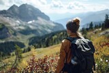 Woman on a mountain hike, scenic view, backpack, adventurous
