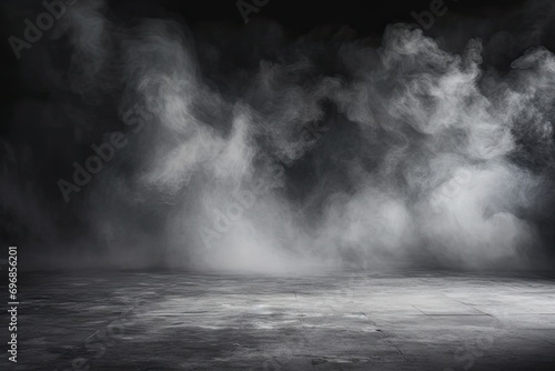 Studio with smoke weave mysterious dance against dark backdrop. Interplay of black and white creates atmospheric effect enhancing sense of mystery and drama