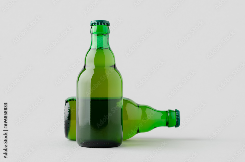 Green steinie beer bottle mockup on a grey background. Green steinie beer bottle mockup on a grey background.