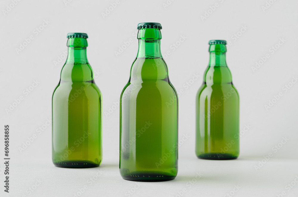 Green steinie beer bottle mockup on a grey background. Green steinie beer bottle mockup on a grey background.