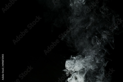 Abstract smoke misty fog on isolated black background. Texture overlays. Design element.