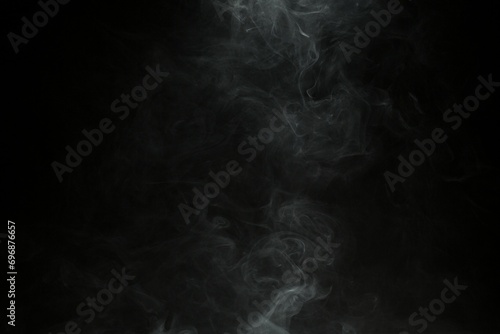 Abstract smoke misty fog on isolated black background. Texture overlays. Design element.