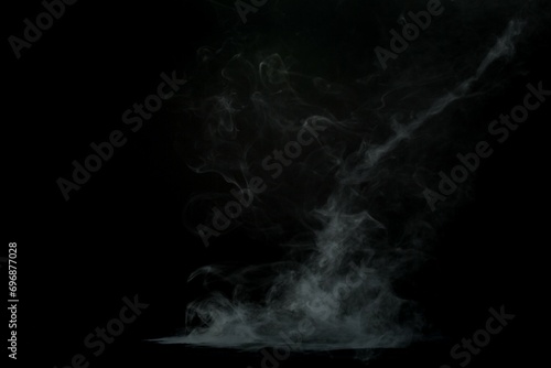 Abstract smoke misty fog on isolated black background. Texture overlays. Design element.
