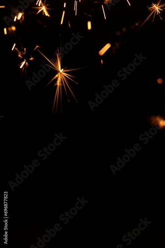 Perfect fire particles embers sparks on black background . Texture overlays.