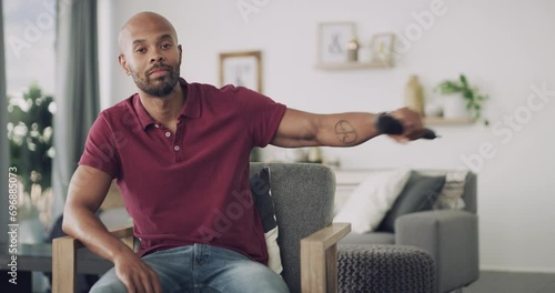 Black man, microphone and portrait in living room, speech and chair for speaking, home and drop mic. Confident, speaker and apartment with face, hosting and presenter for practice, host and house photo