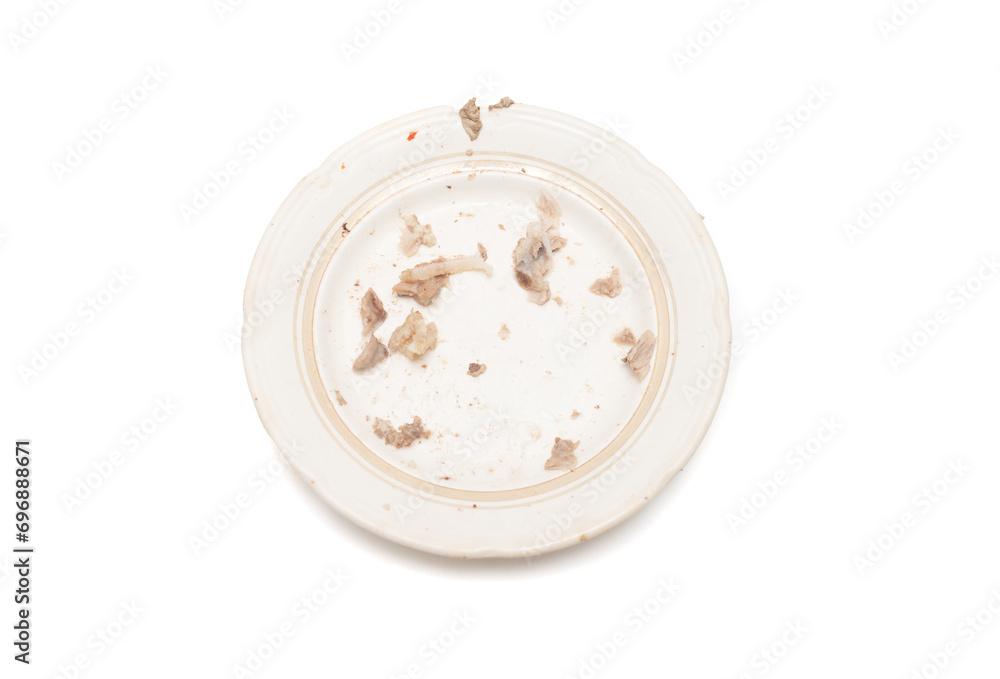 plate after eating meat on white background plate after eating meat on white background