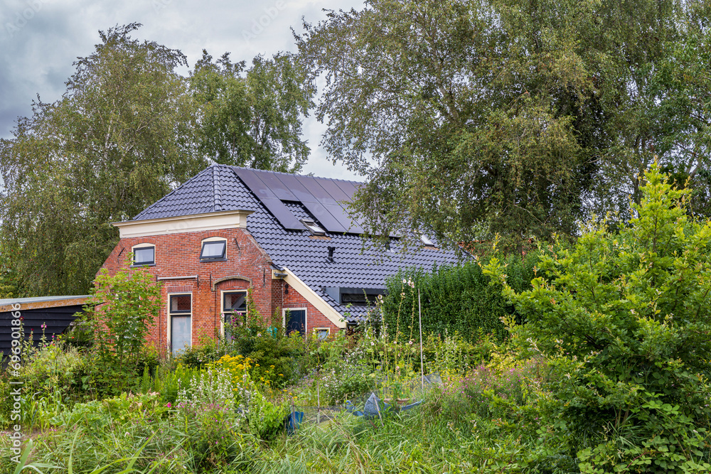 Old farm in village Mensingeweer municipality Het Hoge Land in Groningen province in The Netherlands