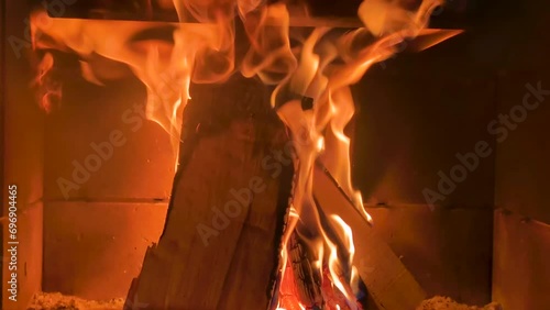 Fireplace with burning wood. Fire blazing from a fireplace