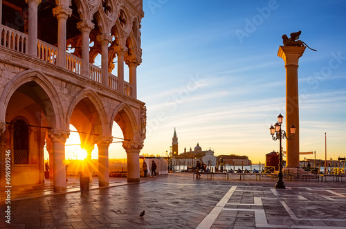 Beautiful sunrise view of Doge's Palace (Palazzo Ducale), Lion of Saint Mark and piazza San Marco in Venice, Italy. photo