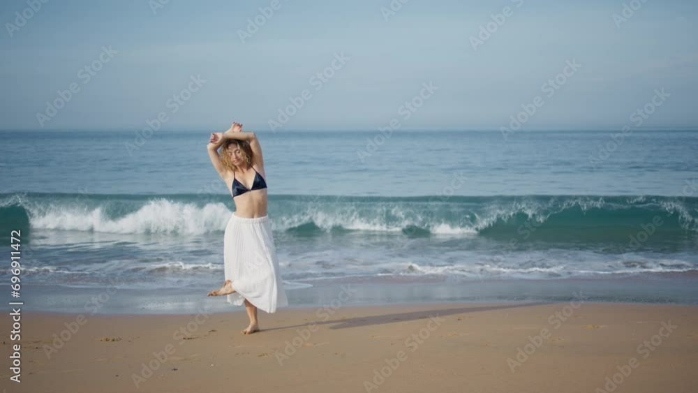 Romantic girl performing dance on beautiful sand beach. Choreographer dancing Romantic girl performing dance on beautiful sand beach. Choreographer dancing