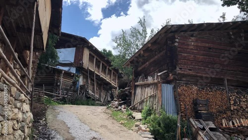 Walking through Maden village unveils a traditional scene of wooden houses, showcasing traditional craftsmanship. Maden village is located in Black Sea highlands, Artvin, Turkiye photo