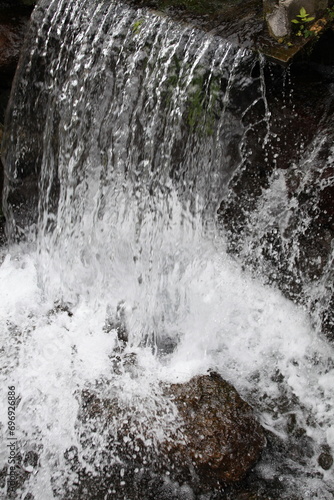 Waterfall in the forest, close up of water flow in the forest