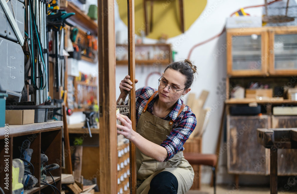 Female carpenter working in her workshop
Female carpenter working in her workshop