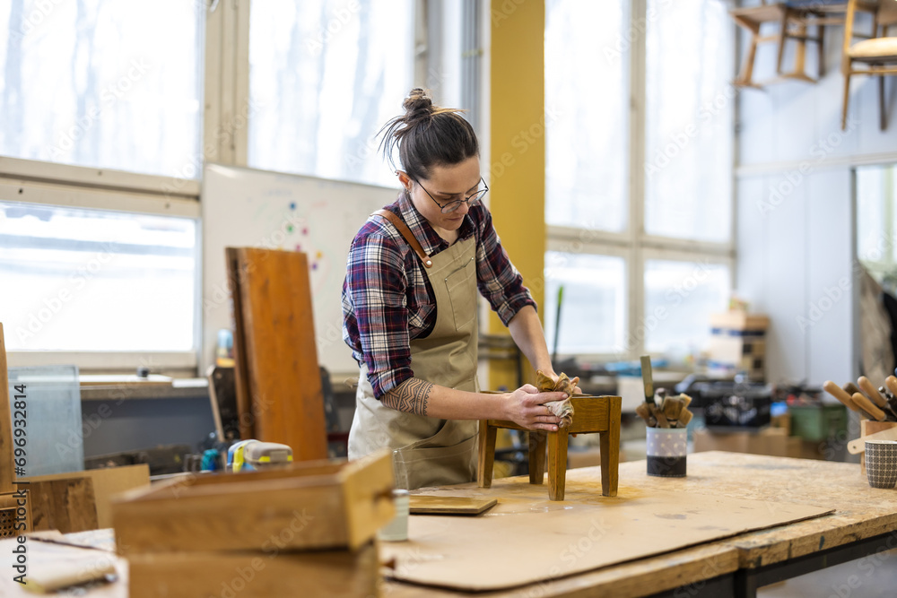 Female carpenter working in her workshop
Female carpenter working in her workshop
