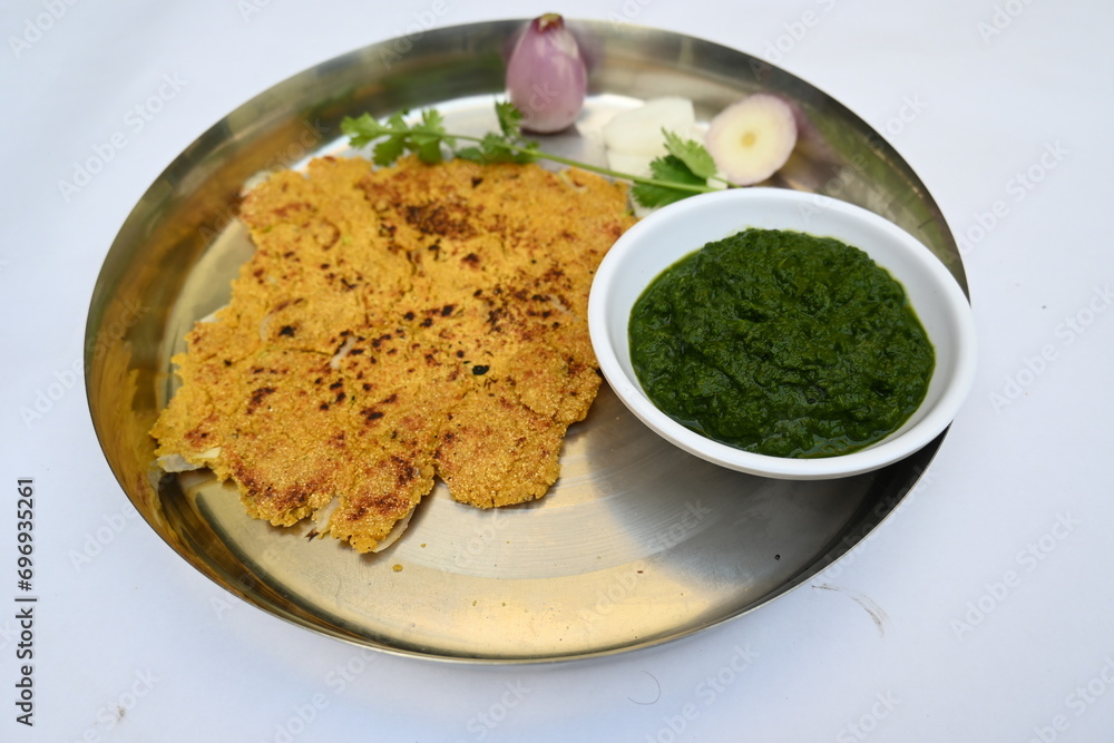 Makki Ki Roti and Sarson Ka Sag. It is Corn floor flat bread and