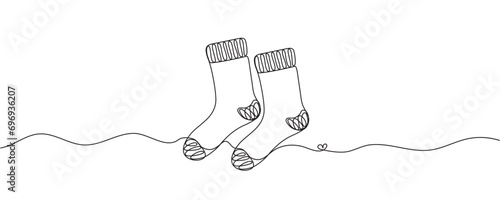 Continuous one line drawing of a Christmas stocking. Christmas sock on a white background. Vector illustration