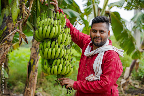 Indian farmer, young, in a banana field