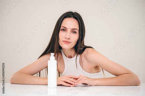 woman with professional shampoo for hair treatment photo