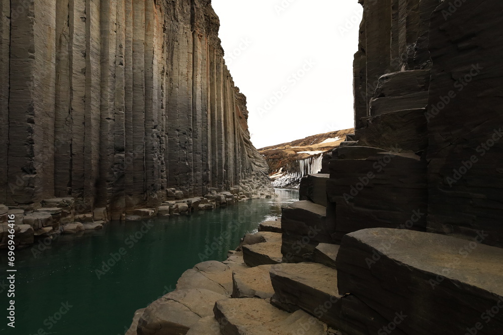 Stuðlagil is a ravine in Jökuldalur in the municipality of Múlaþing, in the Eastern Region of Iceland. It is known for its columnar basalt rock formations and the blue-green water that runs through it