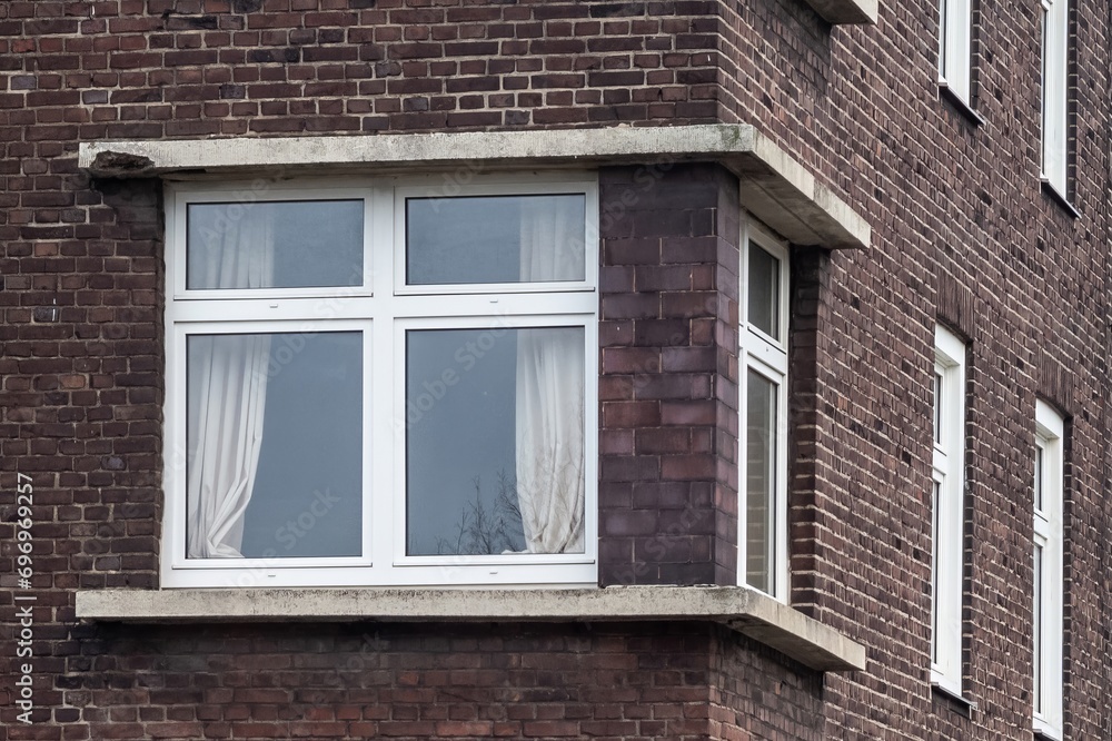 Corner window of a brick residential building Corner window of a brick residential building