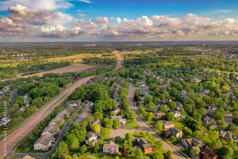 Suburban Neighborhood and Four Lane Road to Horizon in Spring