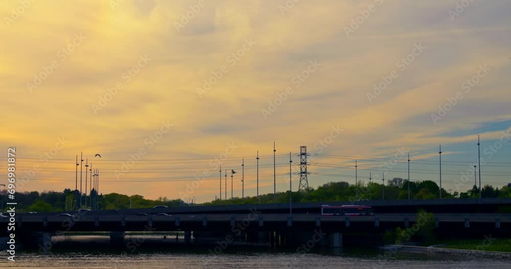 Aerial shot bridge over lake at sunset Sunset on lake bridge as a symbol of nature-city balance. Tranquil lake sunset bridge in serene setting epitome of relaxation and rejuvenation. Aerial shot bridge over lake at sunset Sunset on lake bridge as a symbol of nature-city balance. Tranquil lake sunset bridge in serene setting epitome of relaxation and rejuvenation.