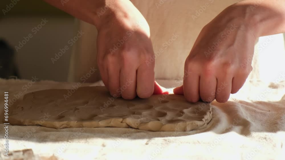 the potter makes a cup and a plate. women's hands make products from clay. the process of making dishes the potter makes a cup and a plate. women's hands make products from clay. the process of making dishes