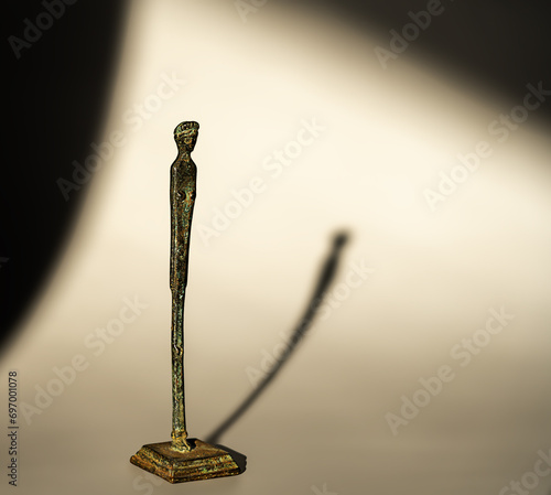 statuette resembling the Etruscan votive bronze statue found at Velletri called the 