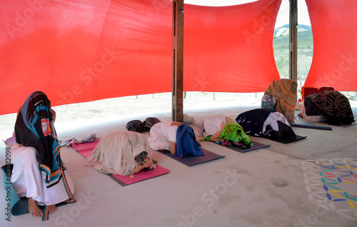 people in a tent, women, kundalini ritual, religious ritual, covered women, people in reverence, people in prayer
