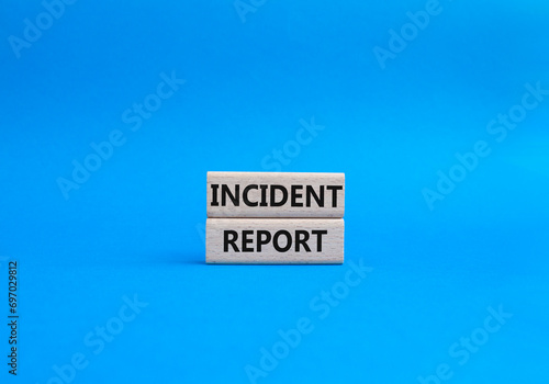 Incident Report symbol. Concept word Incident Report on wooden blocks. Beautiful blue background. Business and Incident Report concept. Copy space