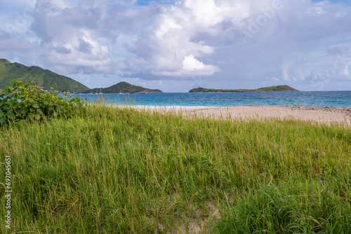Beautiful Orient Beach With a View of Lush Green Mountains of St. Martin on the Left and Pinel Island on the Right photo