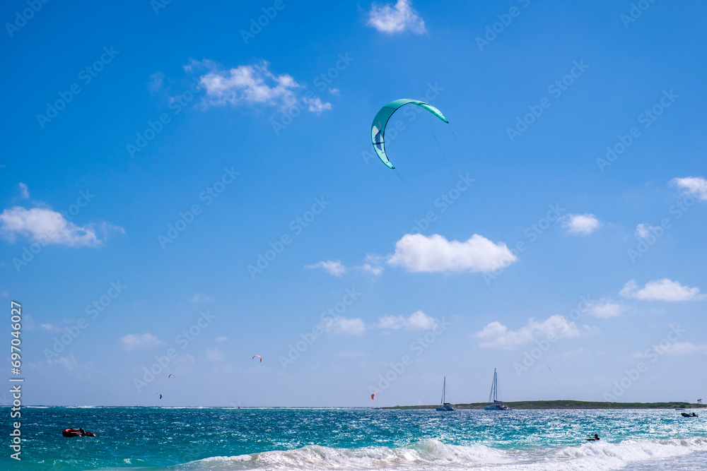 Kite Surfing and Kite Boarding on Orient Bay in St. Martin on a Beautiful Sunny Day Kite Surfing and Kite Boarding on Orient Bay in St. Martin on a Beautiful Sunny Day