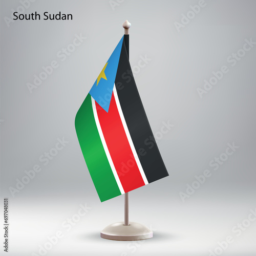 Flag of South Sudan hanging on a flag stand.