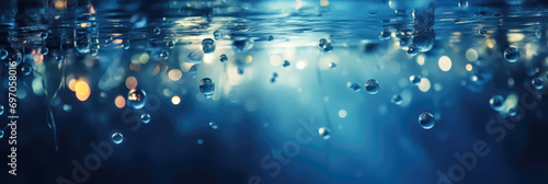 Underwater background with water bubbles and undersea light rays shine