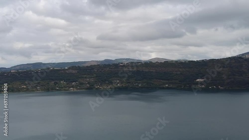 Panning at right over Albano lake in fantastic cloudy day with wonderful colors and dramatic sky