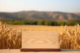 Mock up of a Jewish holiday Shavuot design, with an empty wooden podium on a table against a wheat field background for product display.