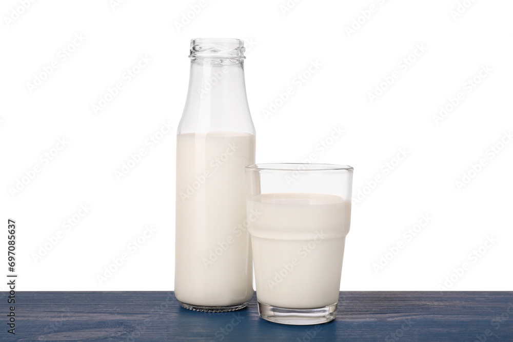 Glassware with tasty milk on blue wooden table against white background Glassware with tasty milk on blue wooden table against white background