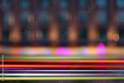 Blurred view of building and light trails in city, motion blur effect © New Africa