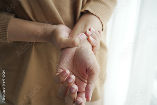  Young women hands suffering wrist pain,  photo