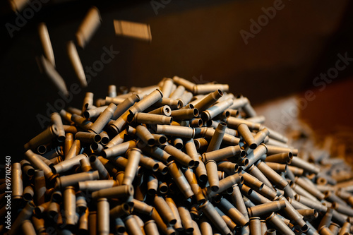 Fototapeta Naklejka Na Ścianę i Meble -  Shell casings fall down in ammunition production workshop