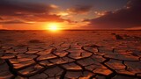 Global warming concept.Soil drought cracked landscape on sunset sky.Dry cracks in the land, serious water shortages.Drought concept.