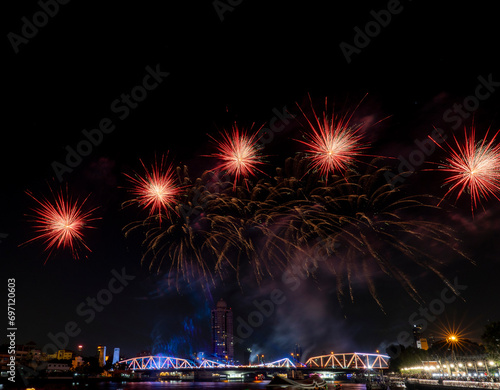 A colorful set of fireworks set off on the Buddhayodfa Chulalok Maharat Bridge in Bangkok. During the New Year Festival of 2024