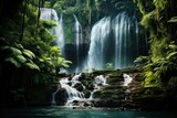 Majestic waterfall cascading down a lush tropical cliff.