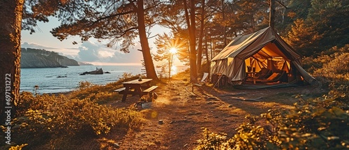 campground near the beach, A tent in the summer sun with empty chairs and a picnic table. Enjoy the outdoors, quality time with family, and the splendour of nature to find happiness. . photo