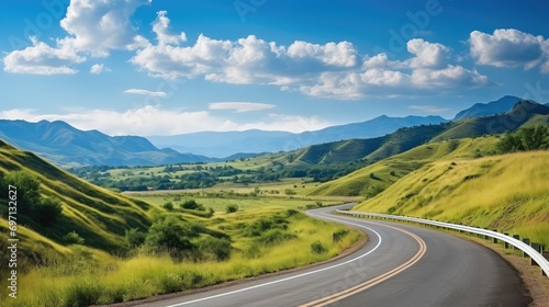 Beautiful curve asphalt road on the green mountain with more clouds on mountain and blue sky background. Generative AI.