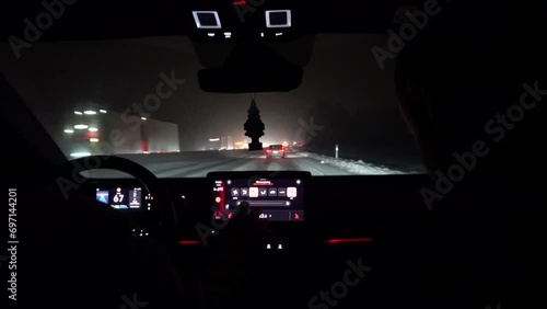 Norrkoping, Sweden The dashboard of a car driving through a severe snowstorm on the E4 highway.  photo