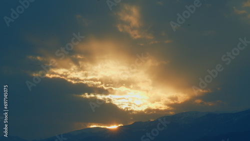 Natural Outdoor Travel Background. Sunrise In The Mountains. Foggy Slopes And Valleys. Real time.